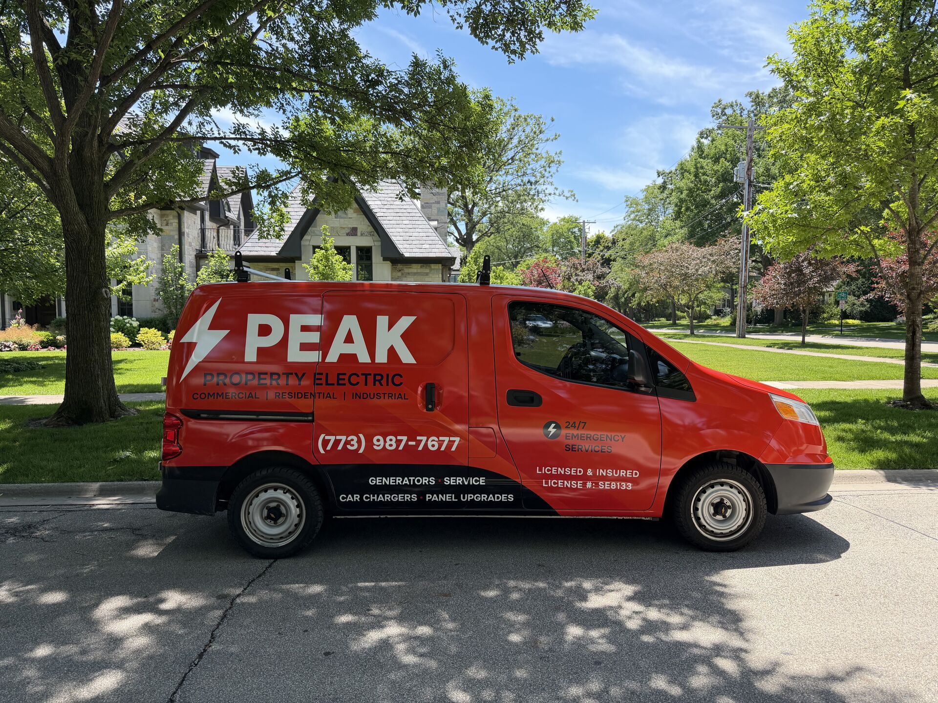 Peak Property Electric's red service van — Commercial | Residential | Industrial