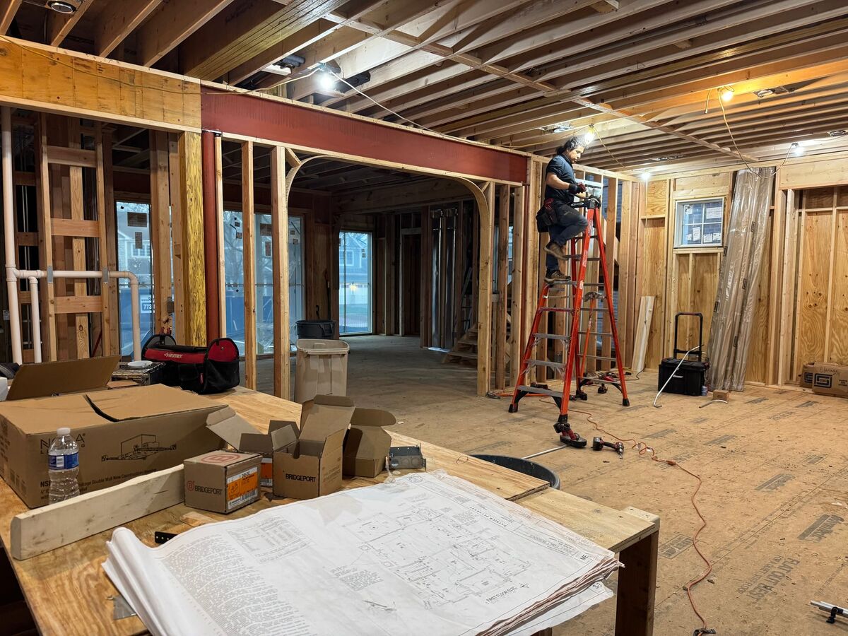 Peak Property Electric electrician working from plans on a job site