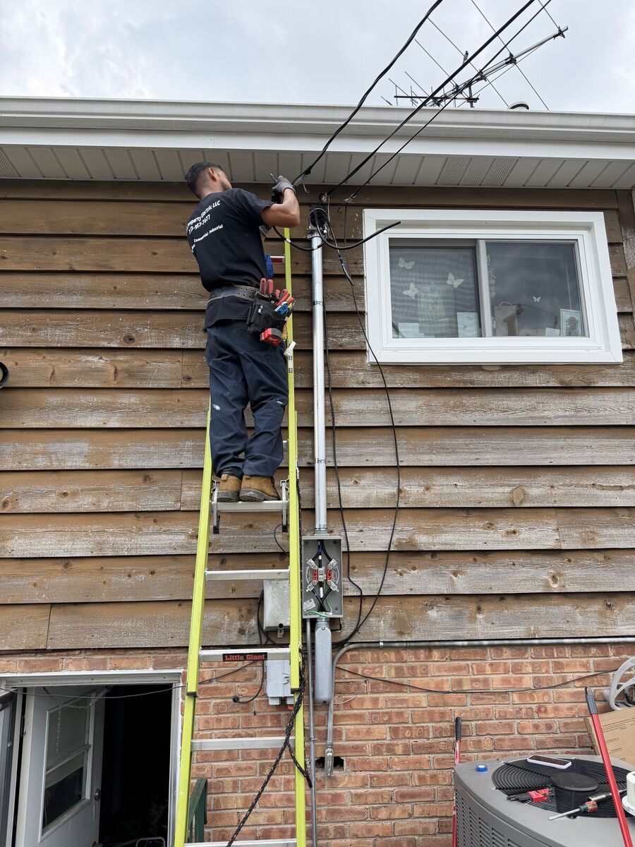 Peak Property Electric electrician installing an overhead service