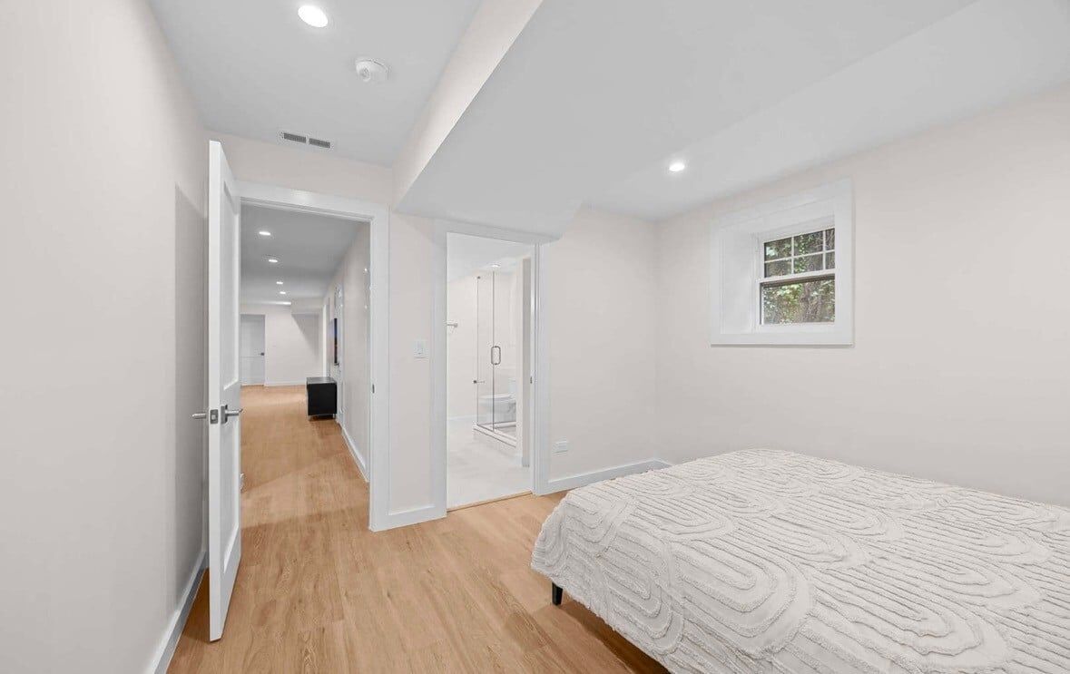 Primary bedroom suite with recessed lighting